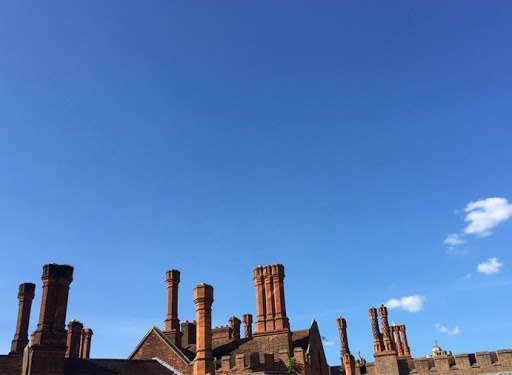 Ornate brick chimney stacks on a period London roofline